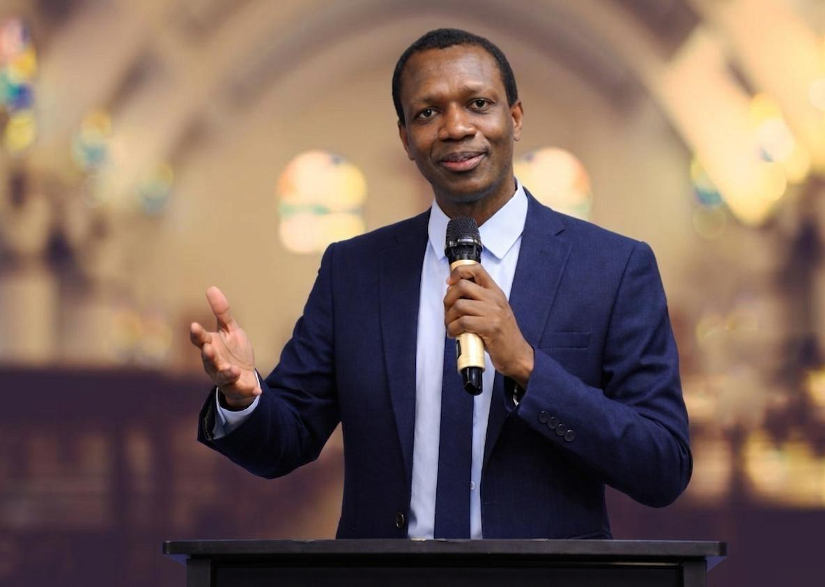 Emmanuel Narh preaching at a podium